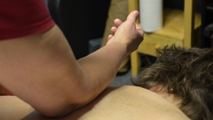 Back massage using forearm